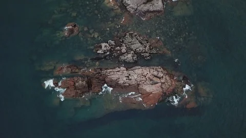 Waves on small granite island Stock Footage 86541912