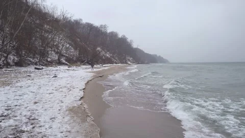 Waves on the snowy beach during winter in Gdynia, Poland. Stock Footage 258886033