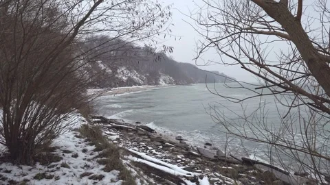 Waves on the snowy beach during winter in Gdynia, Poland. Stock Footage 258886040