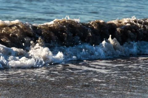 Waves is spalshing at shore Stock Photos