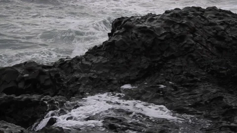 Waves Splash against Rocks on Icelandic Black Sand Beach Stock Footage 140925076