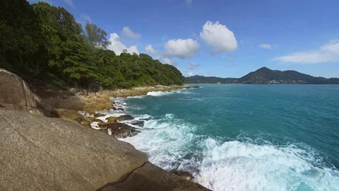 Waves Splash against Rocky Tropical Beach in Phuket, with Sound Видео 82985694