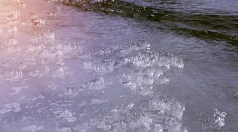 Waves splash at the boundary ice Stock Footage 60580557