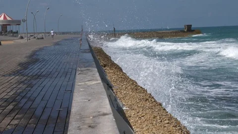 Waves splash on the pier Stock Footage 75930060
