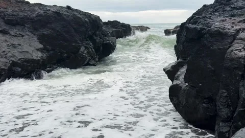 Waves splash on rock and sand channels on the beach of Oregon, USA. Stock Footage 255293419