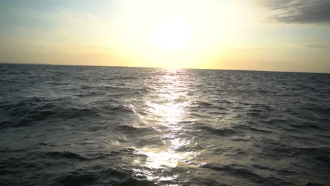 Waves with splashes at sunrise. slow motion 動画素材 111806612