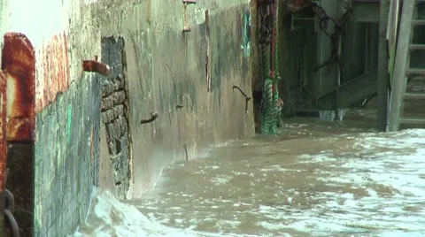Waves splashing against wall Stock Footage 8826417