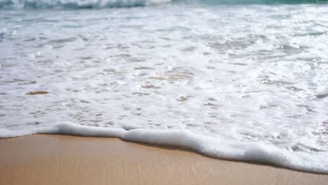 Waves splashing into beach sand texture sea background Stock Footage 156338056