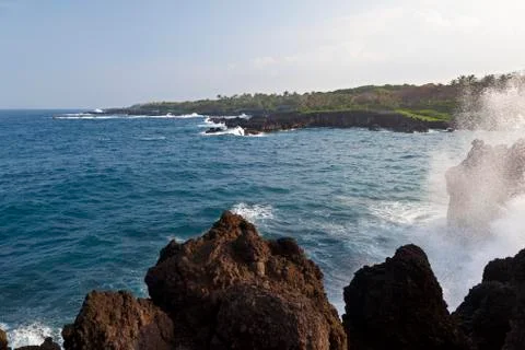 Waves splashing on cliffs in eastern Maui, Hawaii. Stock Photos
