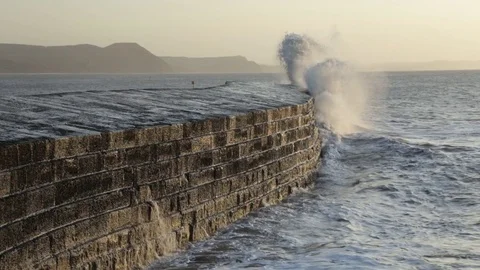 Waves splashing on The Cobb Stock Footage 121346651
