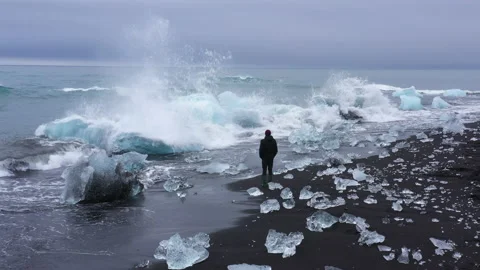 Waves Splashing on Diamond Beach's Blue Icebergs Stock Footage 233452601