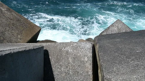 Waves splashing foam on the rocks Stock Footage 196243372