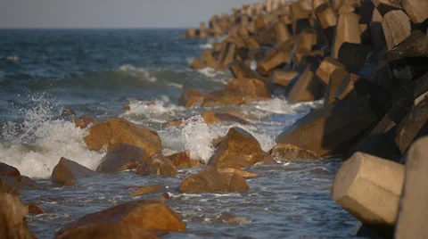 Waves splashing over rocks at the beach Stock Footage 32255501