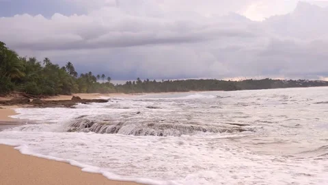 Waves Splashing Rock  Beach Shore at Sunset Stock Footage 219415908
