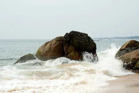 Waves Splashing on Rocks at Beach Stock Photos