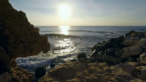 Waves splashing on rocks on Caesarea shore Video stock 71977173