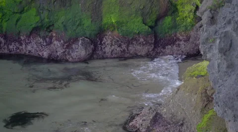 Waves splashing on the rocks from the cliff Stock Footage 68021707