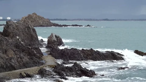 Waves splashing on on rocks Stock Footage 73927636