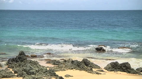 Waves splashing rocks mov file Stock Footage 30571325