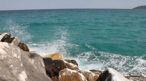 Waves splashing on rocks at seashore Video stock 30716029