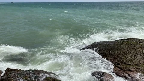 Waves splashing on rocks on a very windy day at sunset Video stock 164873308