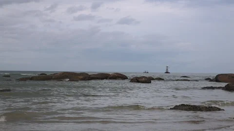 Waves splashing on rocky shore tracking Stock Footage 29909084
