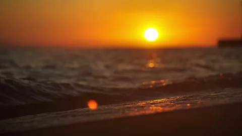 Waves splashing on sand Stock Footage 213047722