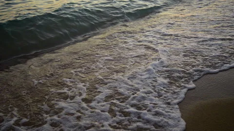 Waves splashing on sand Stock Footage 213075614