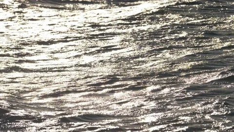 Waves splashing sandy beach in slow motion at sunset Stock Footage 166520968