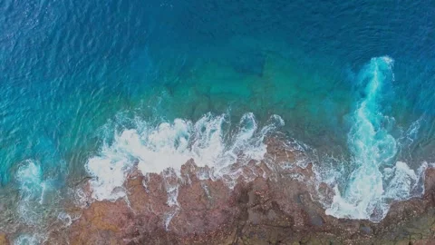 Waves splashing in stormy weather on cliffs in the afternoon 動画素材 254674118