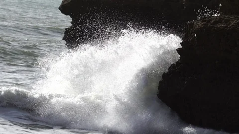 Waves splasing on the rocks, slow mo Stock Footage 103852803