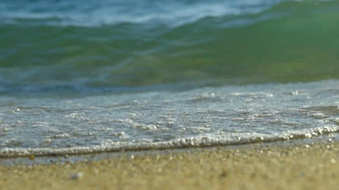 Waves splshing on sandy beach Stock Footage 212776761