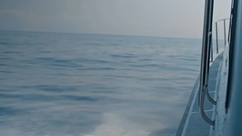 Waves Spray as Boat Sails on Calm Ocean Video stock 333820309