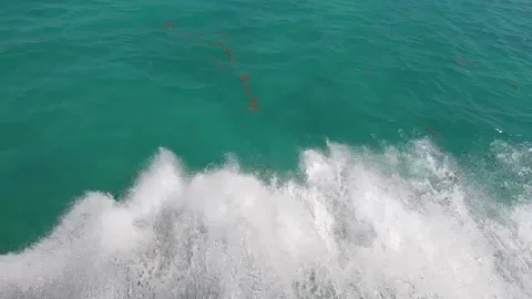 Waves spraying away from the ferry boat while riding over turquoise water Stock Footage 178371219