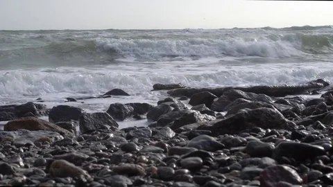 Waves on a stone sea shore Stock Footage 83834028