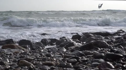 Waves on a stone sea shore Stock Footage 147736963