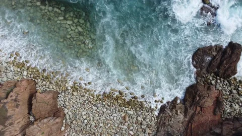 Waves in stones beach, closeup vertical view Stock Footage 160569404