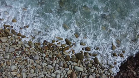 Waves in stones beach, closeup vertical view Stock Footage 160601524