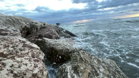 Waves on the stones of the dam in slow motion Stock Footage 223597124