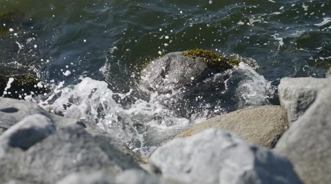 Waves &amp; Stones - Slow motion Stock Footage 52116280