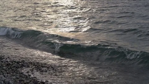 Waves on stony beach Stock Footage 73212776
