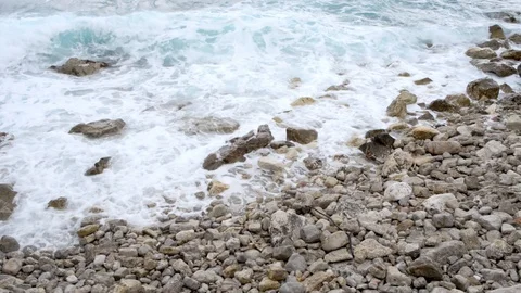 Waves at stony pebble beach Stock Footage 121680868