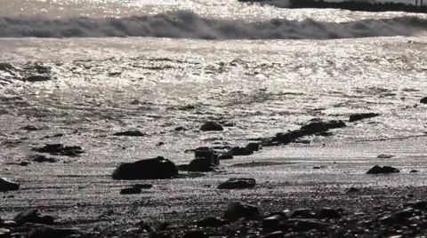 Waves in stony wild coast Stock Footage 65499560