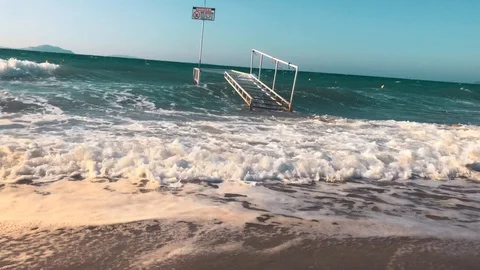 Waves at storm in Mediterranean Sea beating on breakwater on Kos Greece Stock Footage 119984126