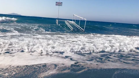 Waves at storm in Mediterranean Sea beating on breakwater on Kos Greece Stock Footage 119984136