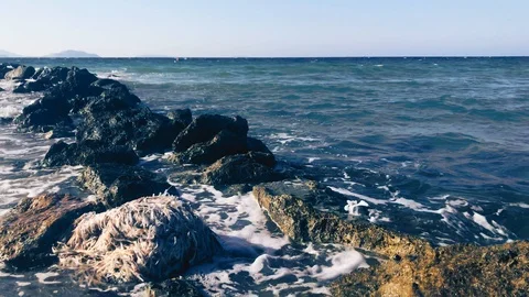 Waves at storm in Mediterranean Sea beating on breakwater on Kos Greece Stock Footage 119984223
