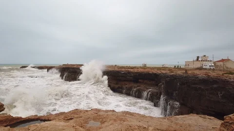 The waves of the storm sea hit the rocks Stock Footage 122453357
