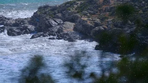 The waves of the storm sea hit the rocks and fly around with a splashes Stock Footage 330889520