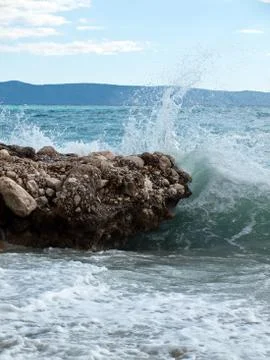 Waves strike the shore Stock Photos