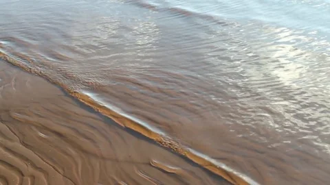 Waves on a striped beach Stock Footage 70392679